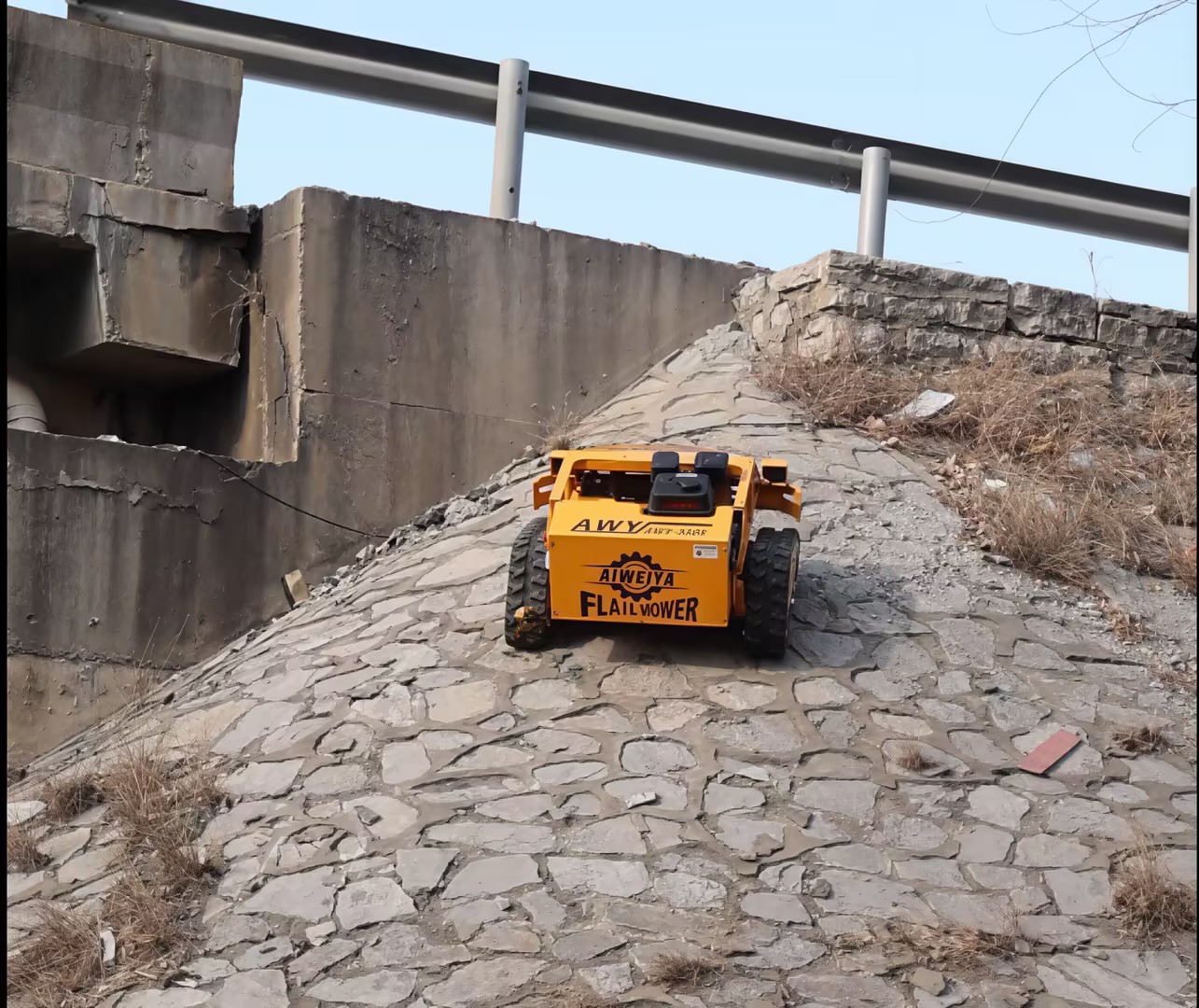 Slope maintenance on highway banks with tracked remote control flail mower