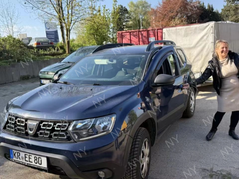 Customer collecting delivered crate using pickup vehicle and trailer
