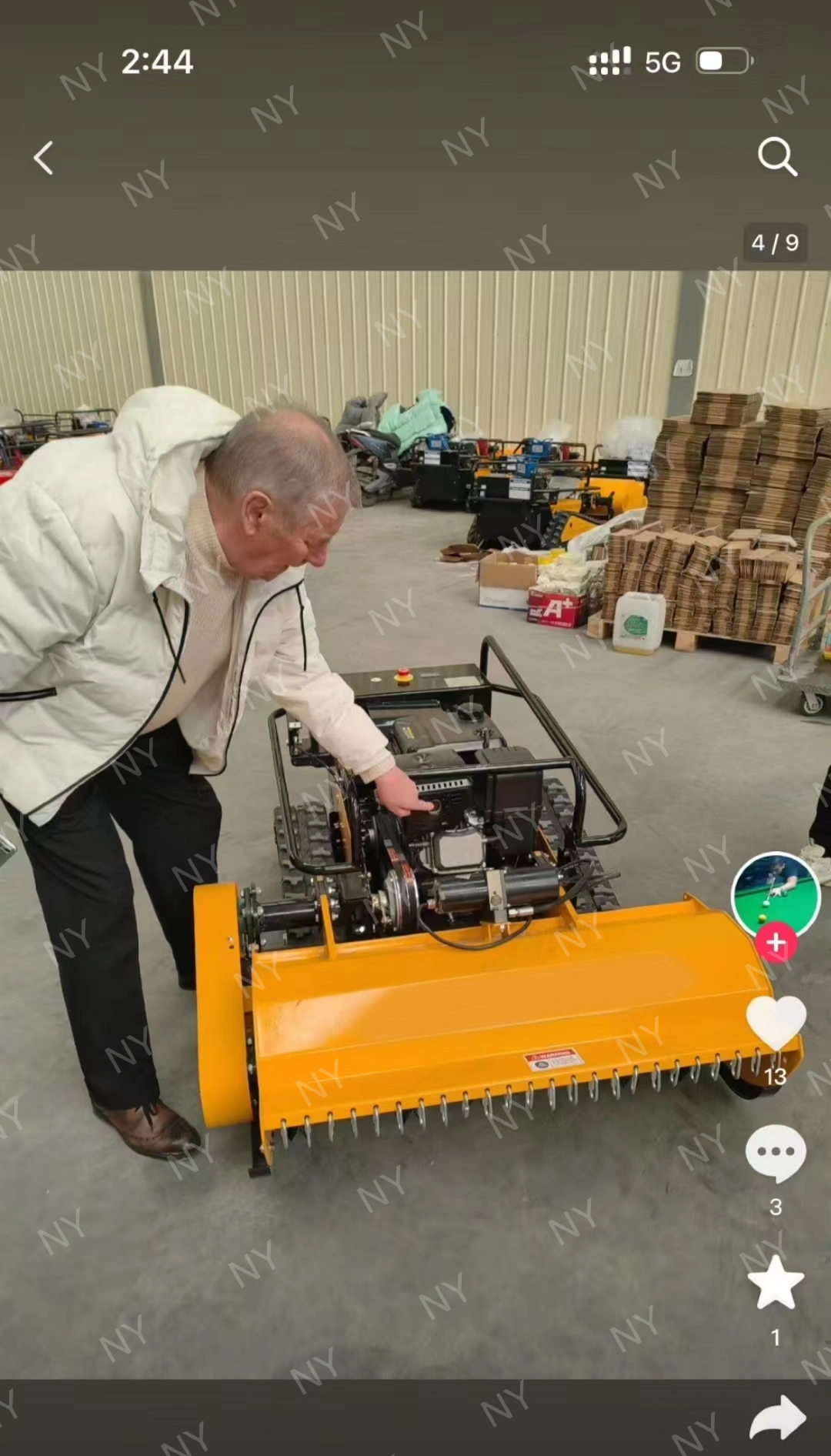 Customer inspecting mower details during visit at factory