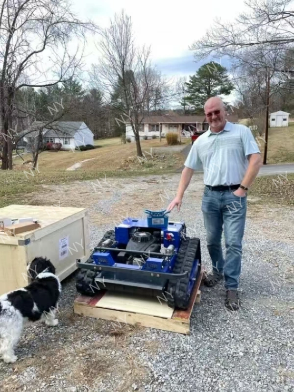Customer standing beside delivered remote mower after unpacking